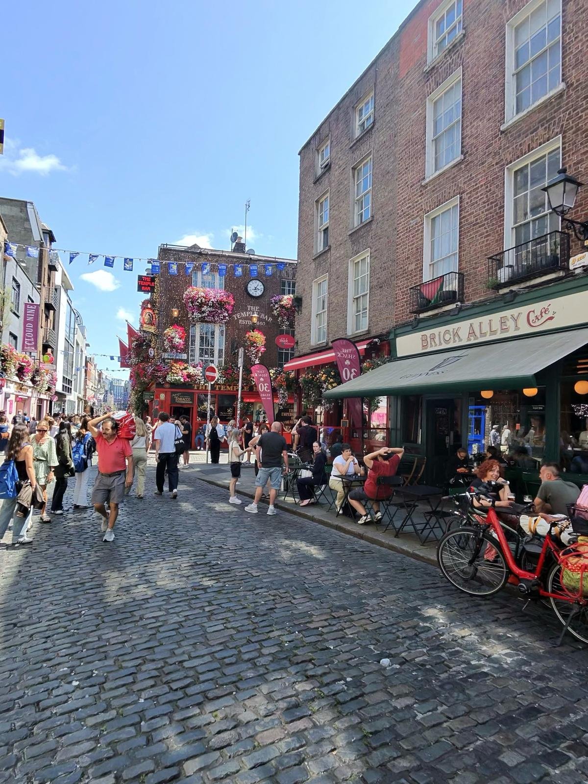 Visitors on the cobbled streets of Temple Bar in Dublin, Ireland